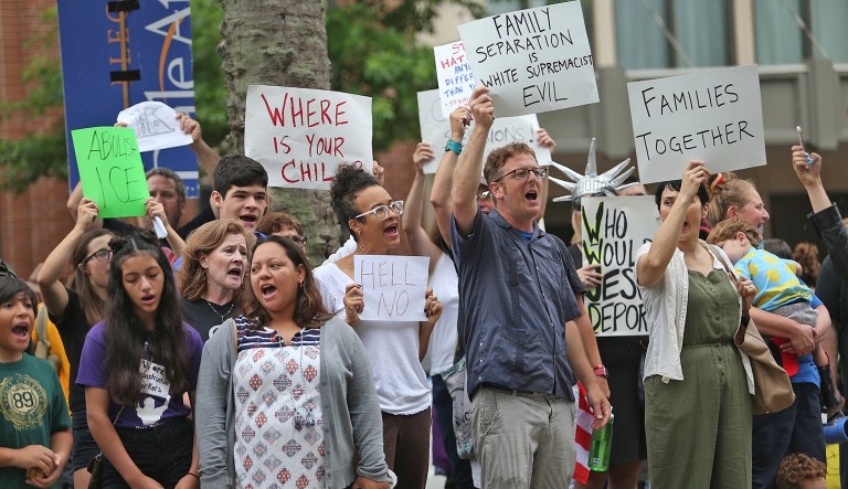 People protest the policy of separating families at the border outside the Ernest N. Morial Convention Center in New Orleans where Attorney General Jeff Sessions was addressing the National Sheriffs' Association on Monday, June 18, 2018. 