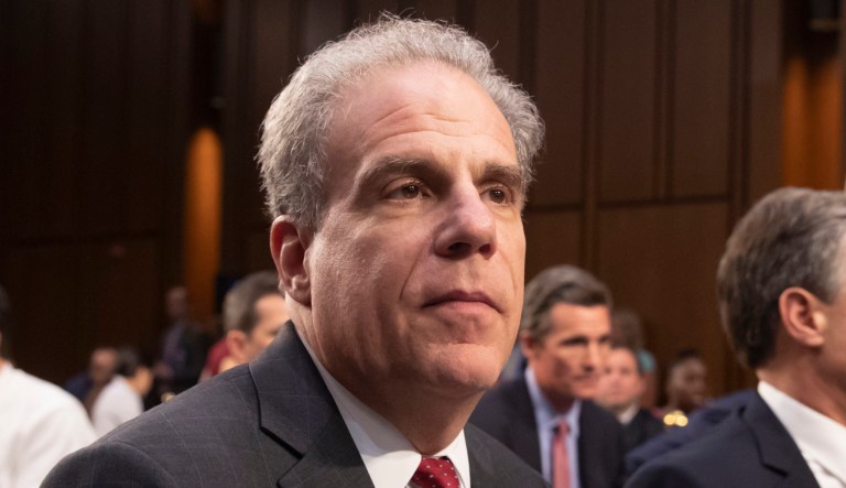 Justice Department Inspector General Michael Horowitz appears at a Capitol Hill hearing in Washington.