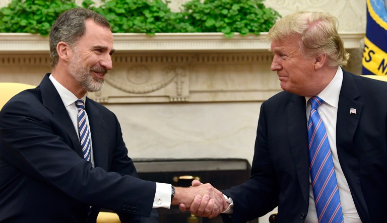President Trump, right, shakes hands with Spain's King Felipe VI, left, at the beginning of their meeting in the Oval Office of the White House in Washington on Tuesday.