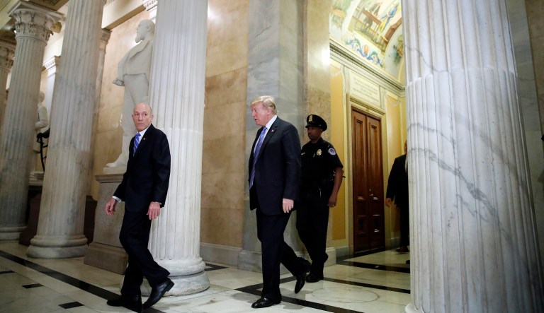President Trump (center) arrives on Capitol Hill in Washington on Tuesday to rally Republicans around a GOP immigration bill.