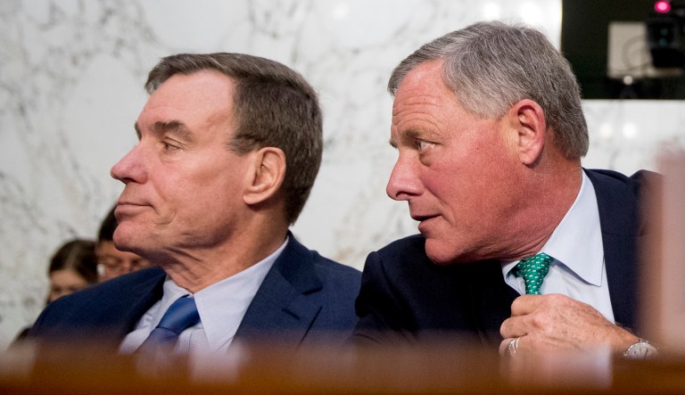 Senate Intelligence Chairman Richard Burr, R-North Carolina, right, speaks with Committee Vice Chairman Mark Warner, D-Virginia, left, during a Senate Intelligence Committee hearing.