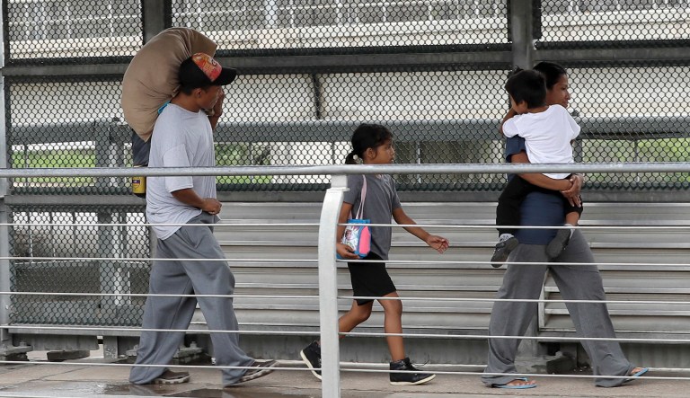 Ever Castillo and his family, immigrants from Honduras, are sent back across the border by U.S. Customs and Border Patrol agents Thursday, June 21, 2018, in Hidalgo, Texas. The parents were told they would be separated from their children and voluntarily crossed back to Mexico after trying to seek asylum in the United States.