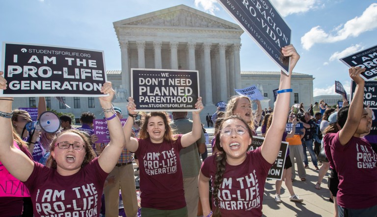 Pro-life and anti-abortion advocates demonstrate in front of the Supreme Court. 