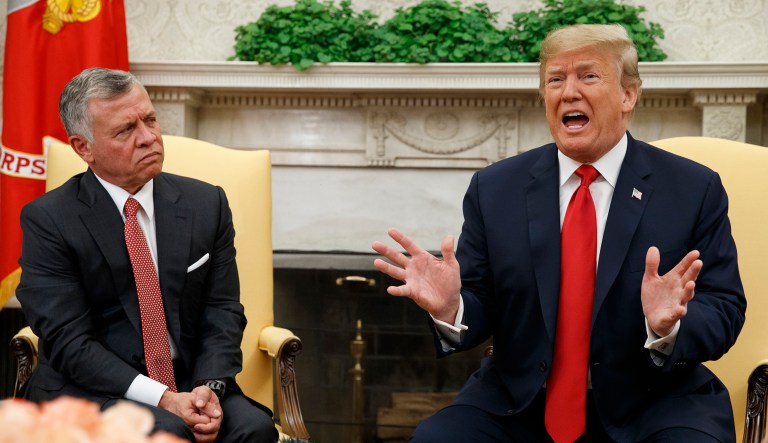 King Abdullah II of Jordan listens as President Trump speaks during a meeting in the Oval Office of the White House.