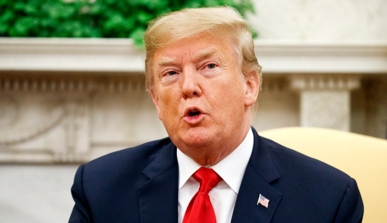 President Trump speaks during a meeting in the Oval Office of the White House in Washington.