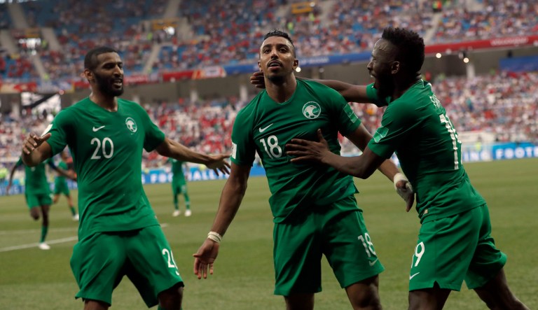 Saudi Arabia's Salem Aldawsari, center, celebrates with teammates after scoring his side's second goal during the group A match between Saudi Arabia and Egypt at the 2018 soccer World Cup at the Volgograd Arena in Volgograd, Russia, Monday, June 25, 2018.