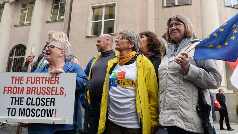 People gather in front of the European Union office to protest the government's judiciary policy, in Warsaw, Poland.