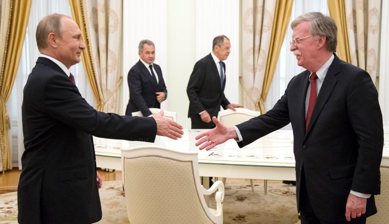 Russian President Vladimir Putin, left, shakes hands with U.S. national security adviser John Bolton during their meeting in the Kremlin in Moscow, Russia, on Wednesday. President Trump's national security adviser is due in Moscow Wednesday to lay the groundwork for a possible U.S.-Russia summit.