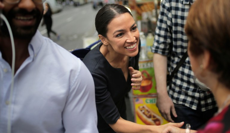 Alexandria Ocasio-Cortez greets a reporter near Rockefeller Center in New York on June 27, 2018. The 28-year-old political newcomer upset incumbent Rep. Joe Crowley in New York's Democrat primary.