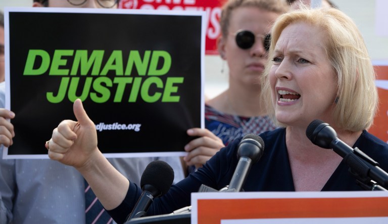 Sen. Kirsten Gillibrand, D-N.Y., joins a protest in front of the Supreme Court in Washington on June 28, 2018.