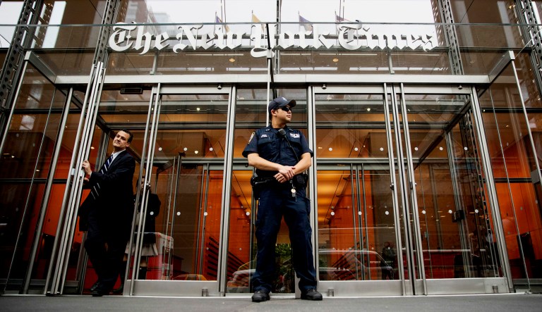 A police officer stands guard outside the New York Times building in New York.