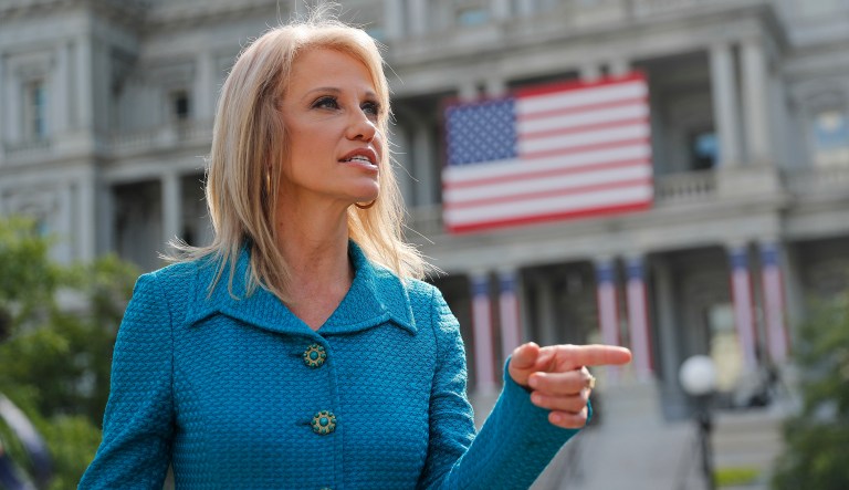White House aide Kellyanne Conway speaks to the media outside the West Wing. 