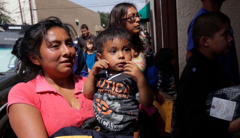 Immigrant families seeking asylum arrive at a respite center after they were processed and released by U.S. Customs and Border Protection, Friday, June 29, 2018, in McAllen, Texas.
