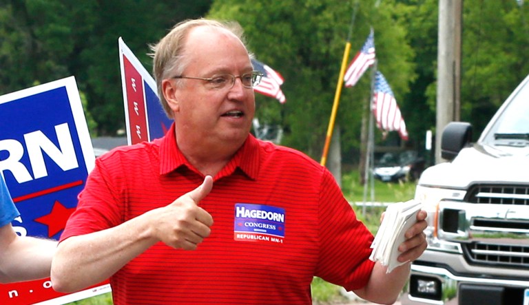 Minnesota 1st District congressional candidate Jim Hagedorn gives a thumbs up as he works a parade in Waterville, Minn.