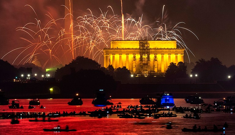Boaters on the Potomac River in Washington watch the fireworks display on the National Mall on July 4, 2018, in celebration of Independence Day.
