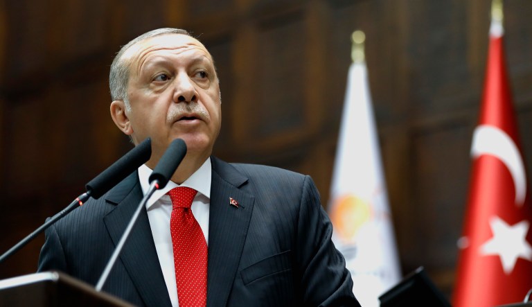 Turkey's President Recep Tayyip Erdogan delivers a speech to MPs at the parliament in Ankara, Turkey.