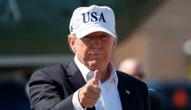 President Trump give the thumbs-up as he boards Air Force One.