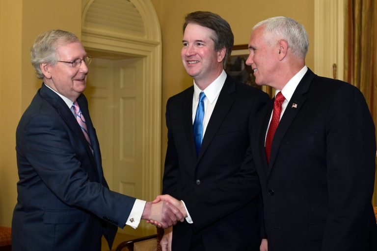 Senate Majority Leader Mitch McConnell of Ky., left, shakes hands with Vice President Mike Pence, right, in front of Supreme Court nominee Brett Kavanaugh, center, during a visit to Capitol Hill in Washington, Tuesday, July 10, 2018.