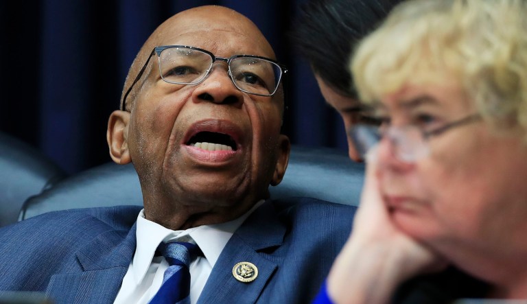 House Judiciary Committee ranking member Elijah Cummings, D-Md., confers with an aide during a joint hearing on "oversight of FBI and Department of Justice actions surrounding the 2016 election" on Capitol Hill in Washington, Thursday, July 12, 2018. 