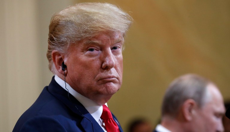 President Trump listens to Russian President Vladimir Putin during a press conference at the Presidential Palace in Helsinki, Finland, on July 16, 2018.