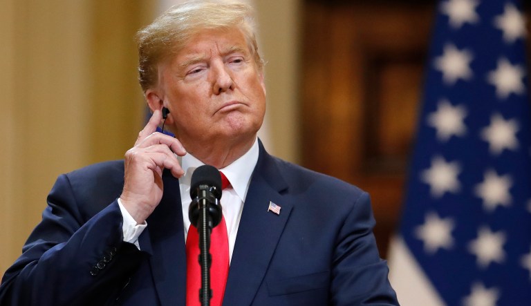 U.S. President Donald Trump listens during a press conference after the meeting of U.S. President Donald Trump and Russian President Vladimir Putin at the Presidential Palace in Helsinki, Finland, Monday, July 16, 2018.