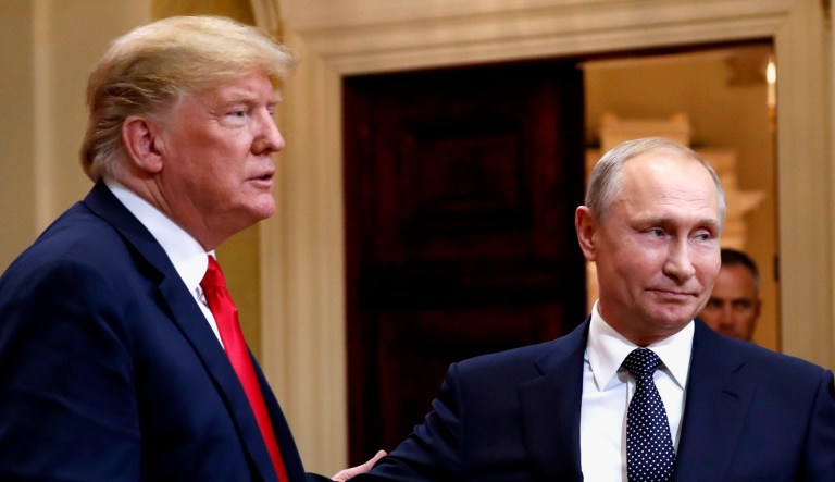 President Trump, left, and Russian President Vladimir Putin leave a press conference after their meeting at the Presidential Palace in Helsinki, Finland.
