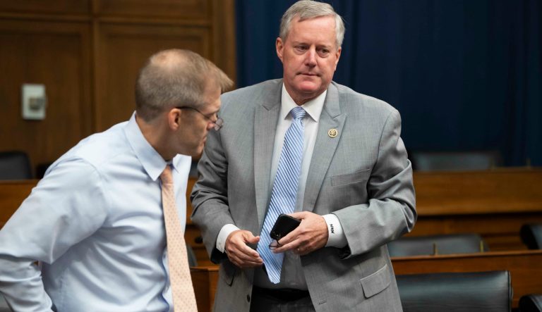 Rep. Mark Meadows, R-N.C., right, chairman of the conservative House Freedom Caucus, and Rep. Jim Jordan, R-Ohio, its founding member, finish a news conference on Capitol Hill in Washington, Tuesday, July 17, 2018. In a Monday letter to the Department of Justice inspector general, Meadows and Jordan are asking for a review of allegations that Deputy Attorney General Rod Rosenstein threatened to subpoena phone records and documents from a House Intelligence Committee staffer. 