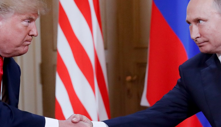 President Trump and Russian President Vladimir Putin shake hands at the beginning of a meeting at the Presidential Palace in Helsinki, Finland, on July 16, 2018.