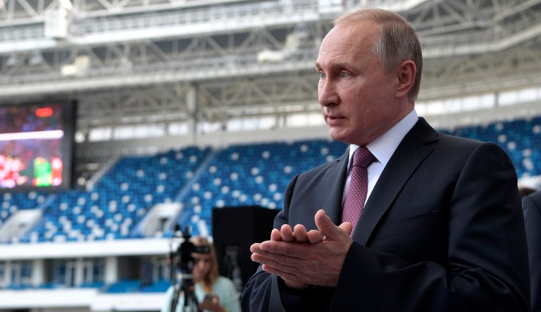Russian President Vladimir Putin gestures while speaking during his visit the Kaliningrad Stadium in Kaliningrad, Russia.