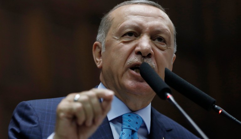 Turkey's President Recep Tayyip Erdogan addresses his ruling Justice and Development Party MPs and supporters at the parliament in Ankara, Turkey, Tuesday, July 24, 2018.  