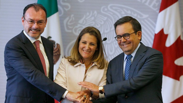 Mexico's Foreign Minister Luis Videgaray, left, Canada's Foreign Affairs Minister Chrystia Freeland, center, and Mexico's Secretary of Economy Ildefonso Guajardo pose for a photo during a joint news conference.