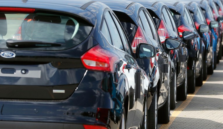 In this Friday, July 21, 2017, file photo, Ford cars wait for deployment after arrival by ship at the Ford Dagenham diesel engine plant in London.