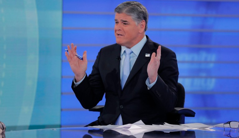 Fox News talk show host Sean Hannity interviews Roseanne Barr during a taping of his show, Thursday, July 26, 2018, in New York. Roseanne Barr will appear on on the Fox News show "Hannity" on Thursday at 9 p.m. EDT for the first time since she was fired from ABC and her namesake show was canceled. ABC canceled its successful reboot of "Roseanne" in May following the star's racist tweet likening former Obama adviser Valerie Jarrett to a cross between the Muslim Brotherhood and a "Planet of the Apes" actor. 