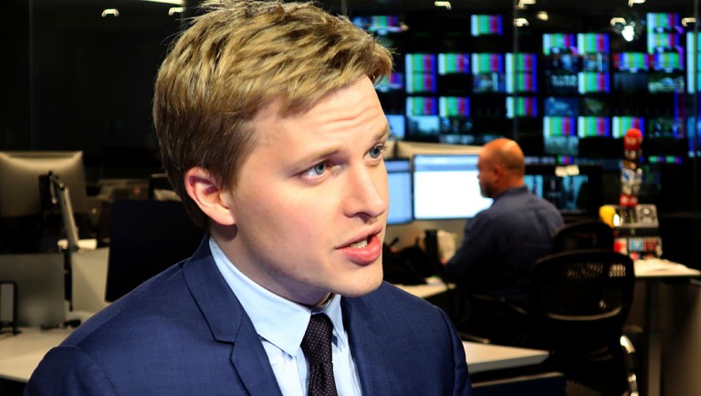 Ronan Farrow, a contributing writer for the New Yorker, speaks with reporters.