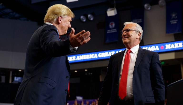 In this June 27, 2018, file photo, President Trump hugs Senate candidate Rep. Kevin Cramer, R-N.D., during a campaign rally in Fargo, N.D.