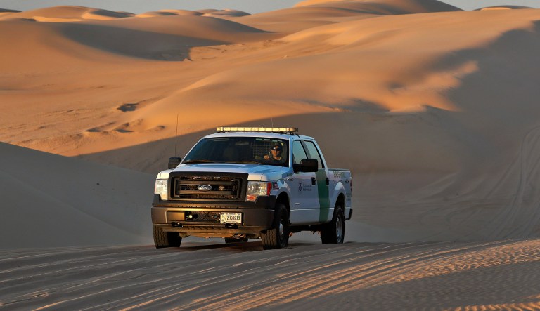 A U.S. Customs and Border Patrol agent patrols a area of sand dunes Wednesday, July 18, 2018 along the international border with Mexico in Imperial County, Calif. 126-miles of border cuts through the Yuma Sector where thousands of families and unaccompanied children are continuing to cross into Arizona and California even after learning of the government's family separation policy upon apprehension.