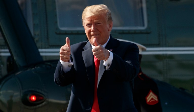 President Trump gives the thumbs-up as he walks from Marine One to board Air Force One. 
