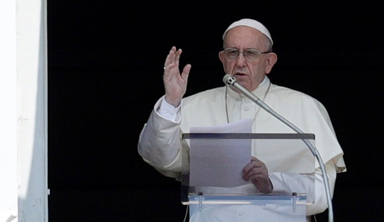 Pope Francis delivers a blessing from his studio window overlooking St. Peter's Square at the Vatican.