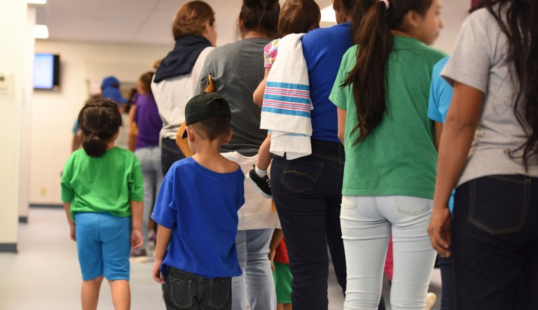 In this Thursday, Aug. 9, 2018, photo, provided by U.S. Immigration and Customs Enforcement, mothers and their children stand in line at South Texas Family Residential Center in Dilley, Texas. Currently housing 1,520 mothers and their children, about 10 percent are families who were temporarily separated and then reunited under a âzero tolerance policyâ that has since been reversed.