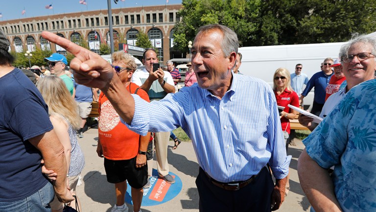 Former House Speaker John Boehner listens during the Des Moines Register Soapbox during a visit to the Iowa State Fair.