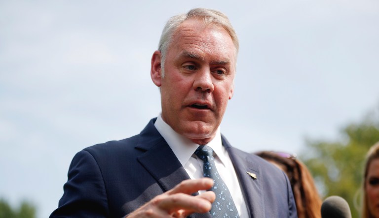 Interior Secretary Ryan Zinke speaks to members of the media outside the White House in Washington, D.C.