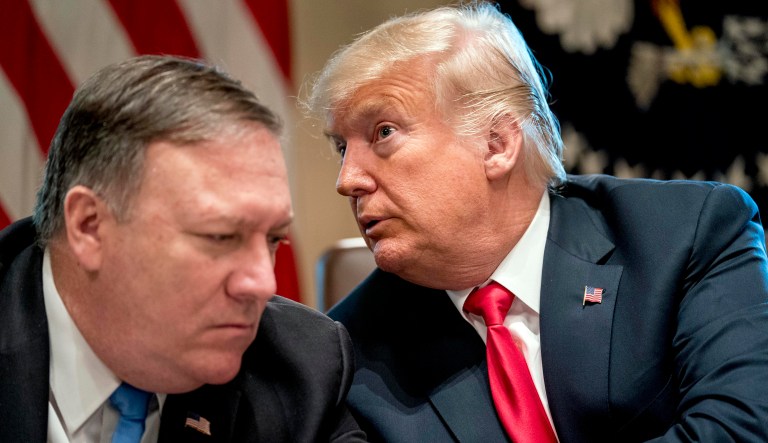 President Trump talks with Secretary of State Mike Pompeo during a Cabinet meeting.
