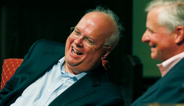 Political strategist Karl Rove, left, laughs with his friend, Pulitzer Prize winning author Jon Meacham, as they discuss the historical progress of politics during the Mississippi Book Festival in Jackson, Miss., Saturday, Aug. 18, 2018.