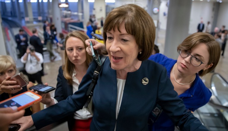 Sen. Susan Collins, R-Maine, speaks with reporters on an escalator at the Capitol in Washington, shortly after meeting with Supreme Court nominee Brett Kavanaugh, Aug. 21, 2018.
