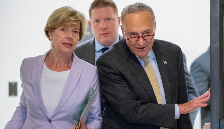 Sen. Tammy Baldwin, D-Wis., and Senate Minority Leader Chuck Schumer, D-N.Y., emerge from a closed-door briefing at the Capitol in Washington, Wednesday, Aug. 22, 2018.