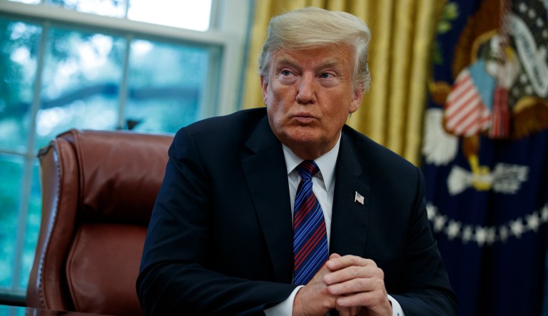 President Trump talks on the phone with Mexican President Enrique Pena Nieto in the Oval Office of the White House, Aug. 27, 2018.