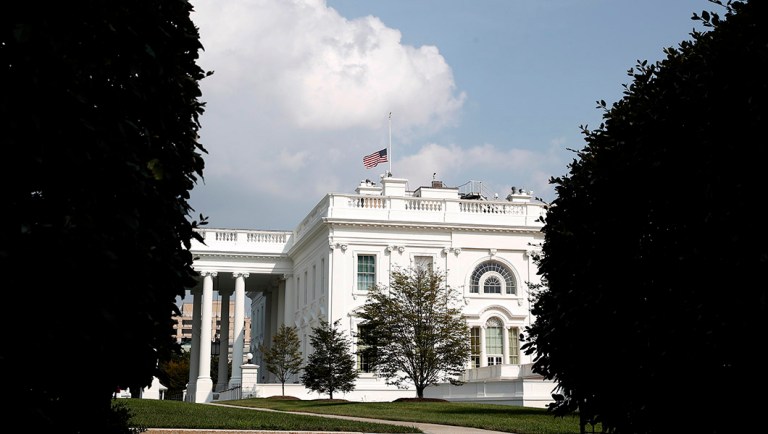 The American flag files at half-staff at the White House.