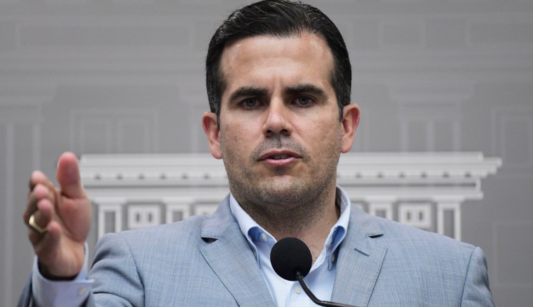 Puerto Rico Gov. Ricardo Rossello speaks during a press conference regarding the number of estimated deaths in the aftermath of Hurricane Maria, in San Juan, Puerto Rico, Tuesday, Aug. 28, 2018. Rossello has raised the island's official death toll from Maria from 64 to 2,975 after an independent study found that the number of people who succumbed after the storm had been severely undercounted.