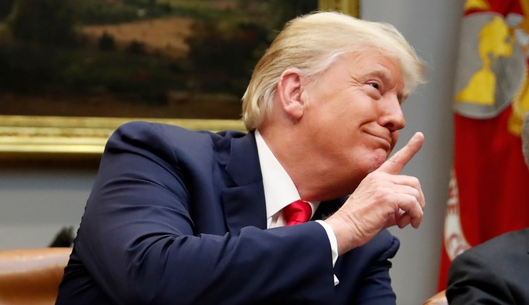 President Trump gestures before speaking during a discussion in the Roosevelt Room of the White House, Aug. 29, 2018, in Washington.