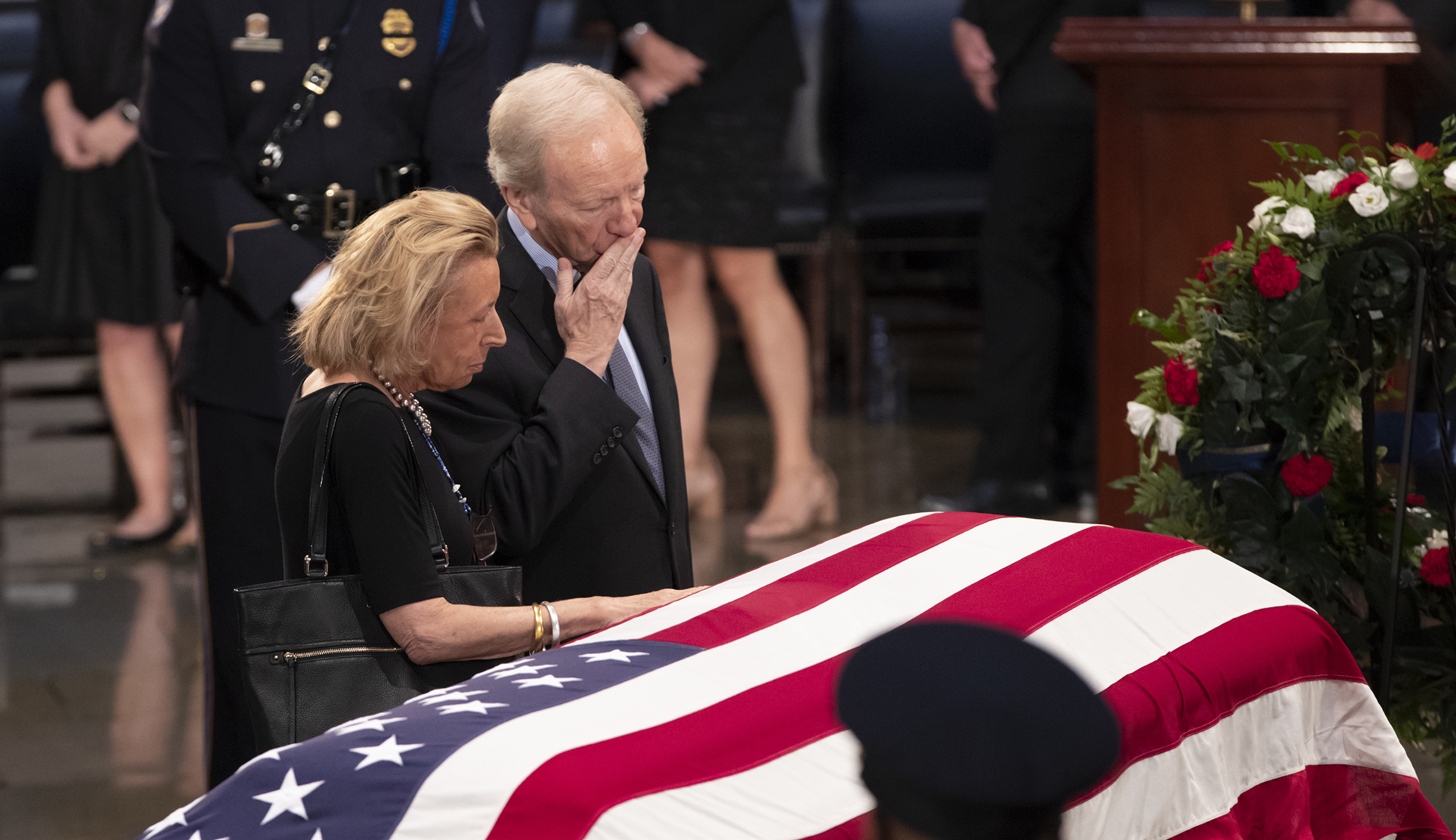 Sen. Joe Lieberman, right, and his wife Hadassah Lieberman, pay their respects at the flag-draped casket of Sen. John McCain of Arizona, who lived and worked in Congress over four decades, in the U.S. Capitol rotunda, Friday, Aug. 31, 2018, in Washington. McCain was a six-term senator, a former Republican nominee for president, and a Navy pilot who served in Vietnam, where he endured five-and-a-half years as a prisoner of war. He died Aug. 25 from brain cancer at age 81.